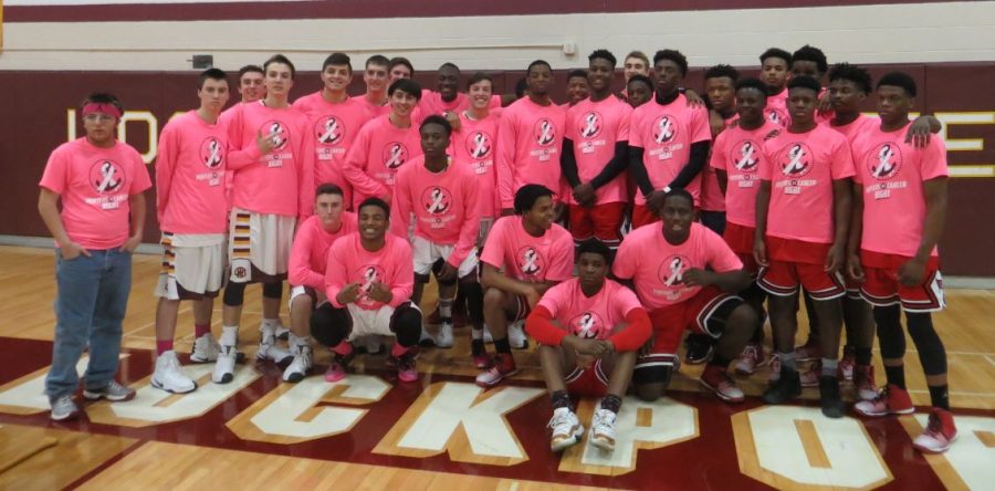 The+boys+varsity+basketball+teams+of+LTHS+and+Bolingbrook%2C+both+teams+decked+out+in+pink+for+Porters+vs.+Cancer+Night.