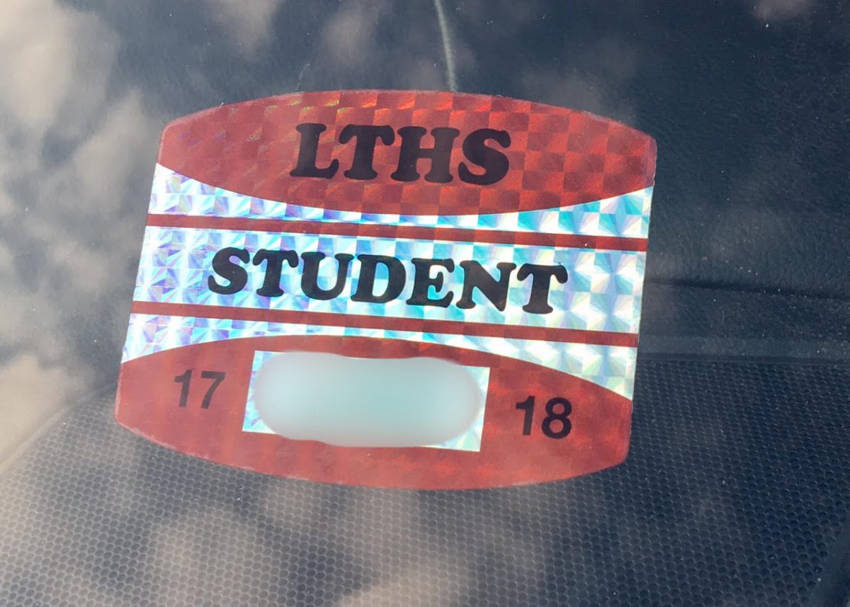 Each+student+who+drives+and+parks+at+school+must+obtain+a+parking+permit+that+looks+like+this.+It+must+be+displayed+on+their+car+window.