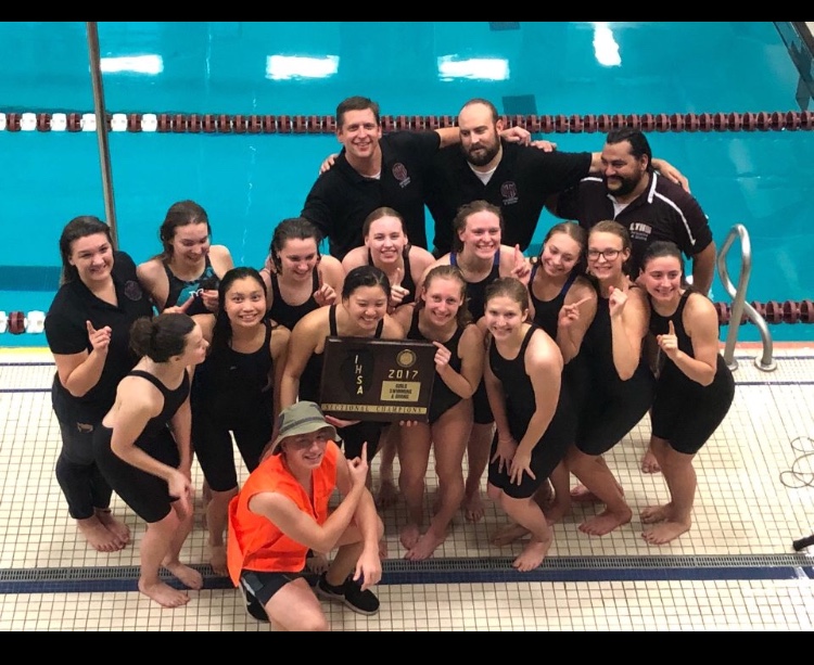 Entire varsity girls swim team at sectionals after placing first