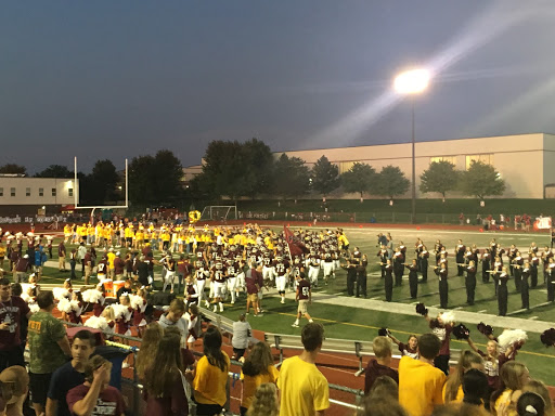 L-Town welcomes the football team as they enter the field.
