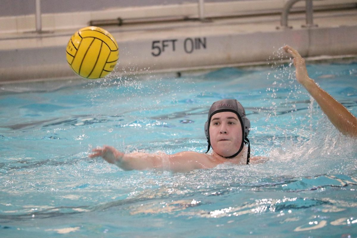 Freshman Henry Tetrick passes the ball to a teammate. 