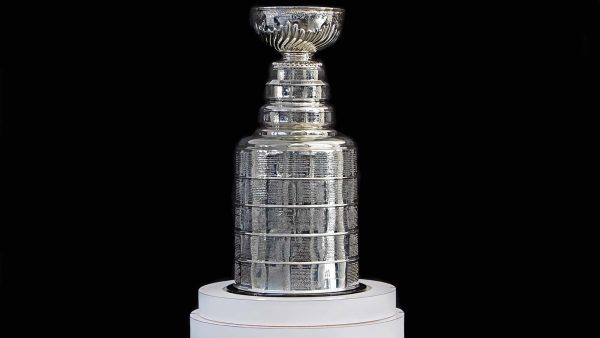 NHL ceremony - Stanley Cup trophy on the white stand, black background, Vancouver BC - October 22, 2018