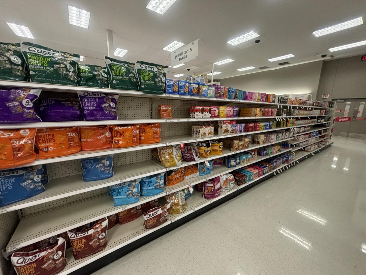 Shelves lined with protein-labeled snacks highlight how the "high-protein" trend has taken over everyday foods.